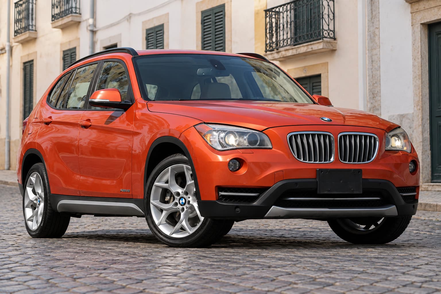 BMW X1 in the Cobbled street scene, created with CarStudio
